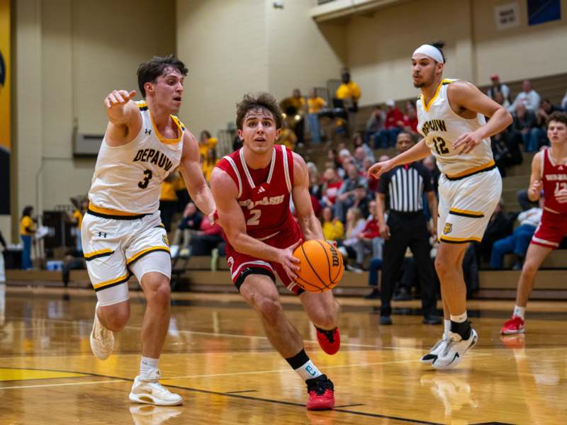 a group of men playing basketball