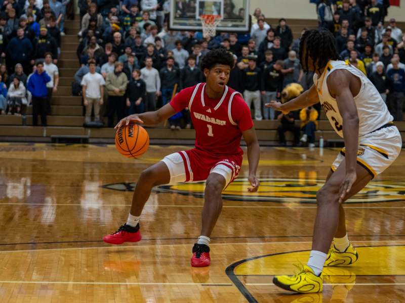 a basketball player dribbling a ball