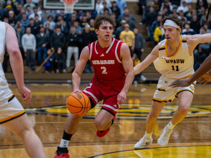 a group of men playing basketball