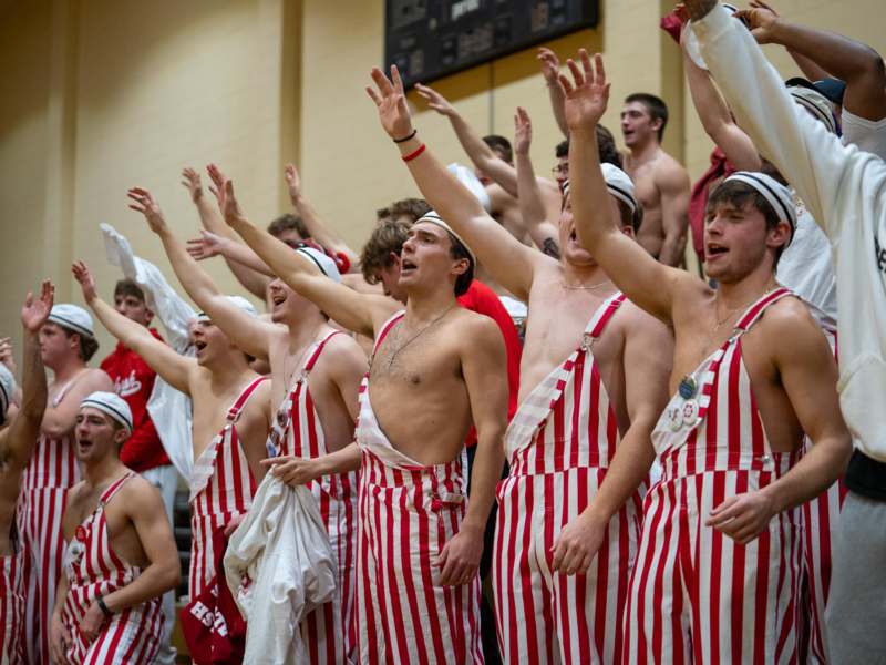 a group of men wearing striped overalls