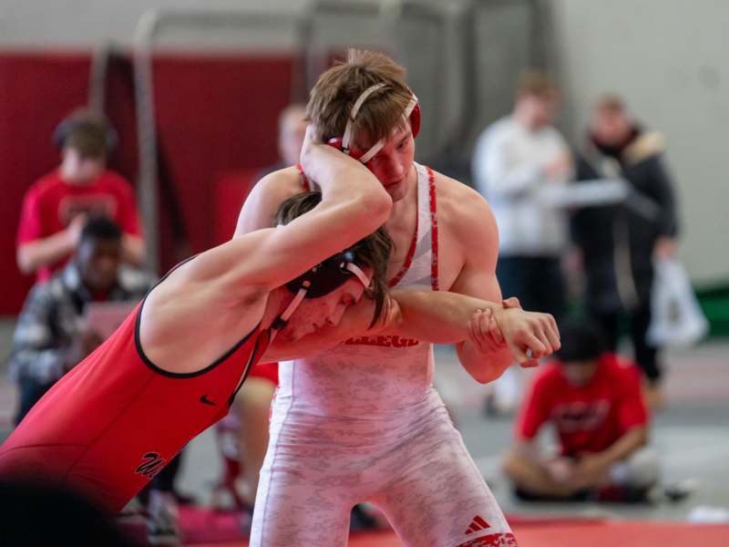a man wrestling another man in a wrestling match