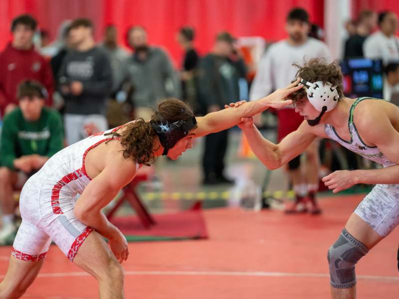 two men wrestling in a wrestling match