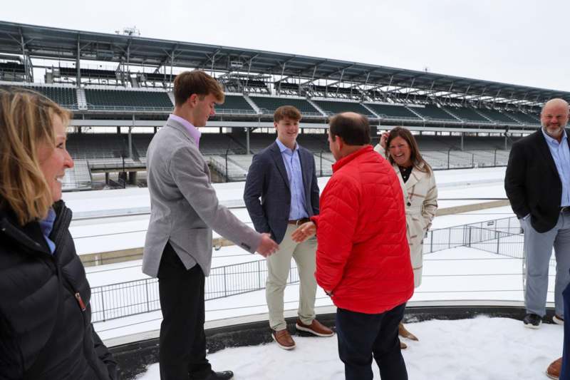 a group of people standing in the snow