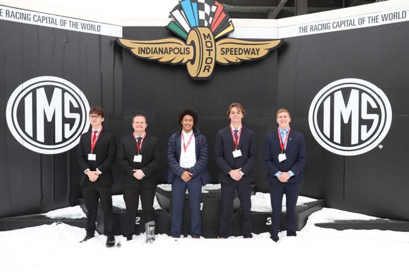 a group of people posing for a photo