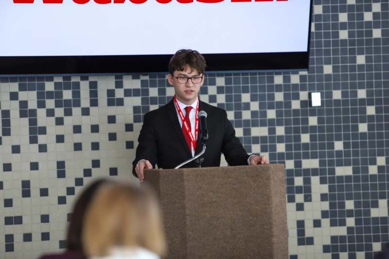 a man standing at a podium
