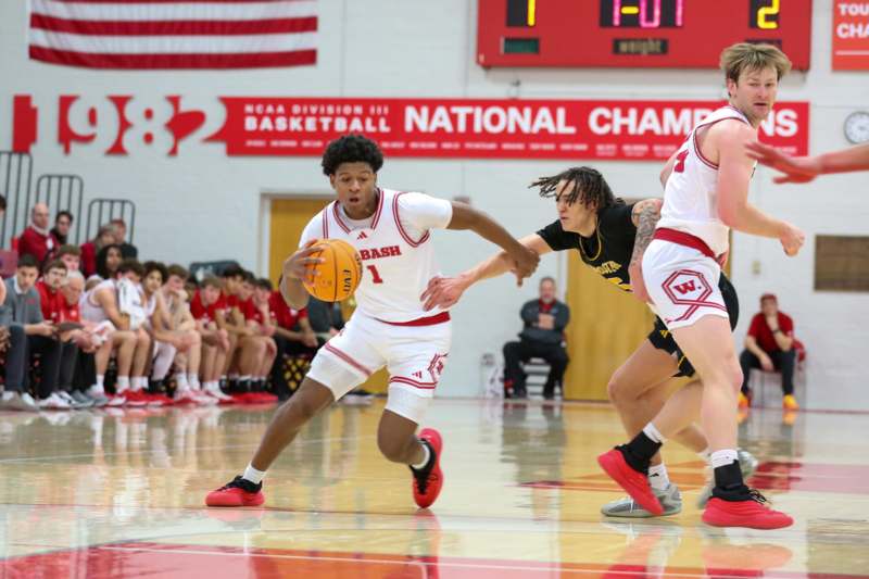a group of men playing basketball