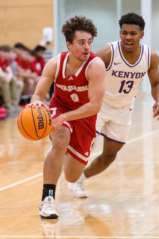 a basketball player dribbling a basketball