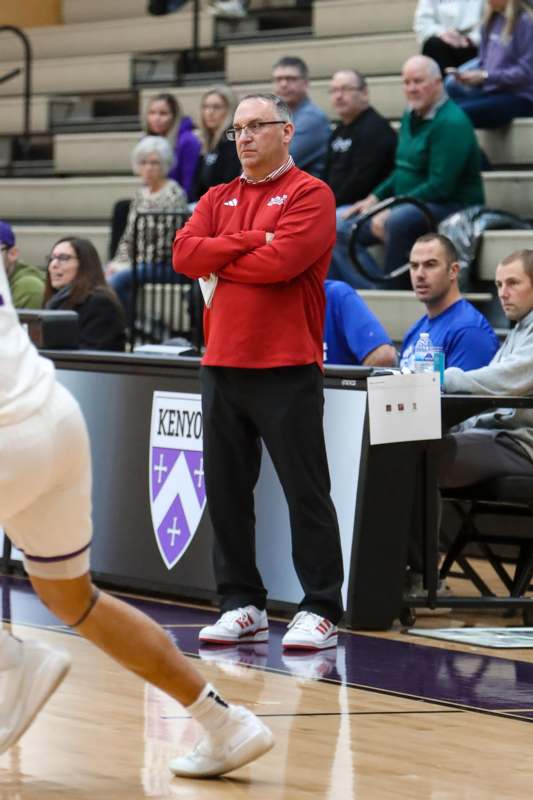 a man standing with his arms crossed