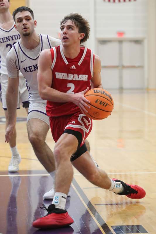 a man in a basketball uniform running with a basketball