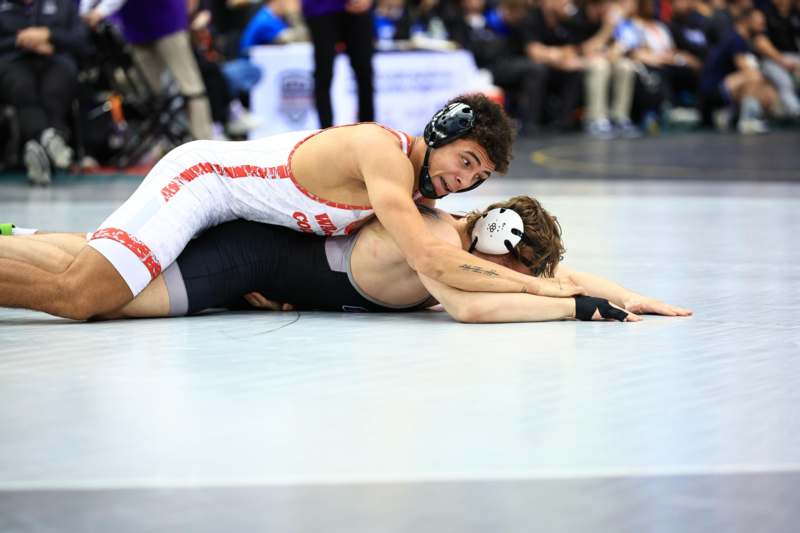 two men wrestling on the floor