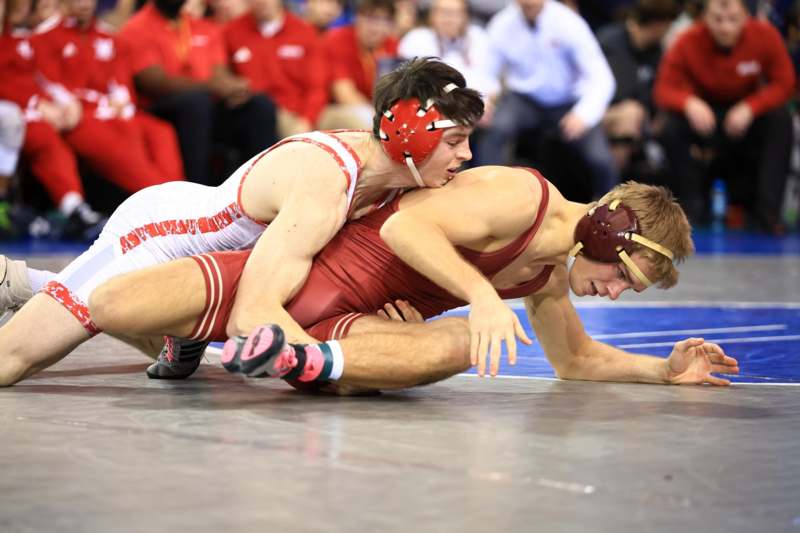 a group of men wrestling