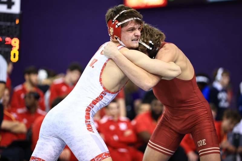 two men wrestling in a wrestling match