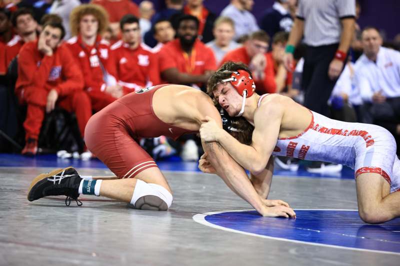 a man wrestling on the floor