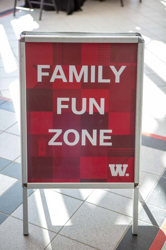 a sign on a tile floor