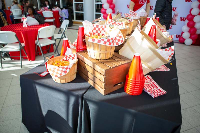 a group of baskets of popcorn on a table