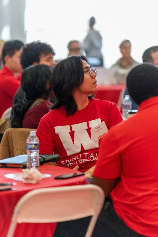 a group of people sitting at tables