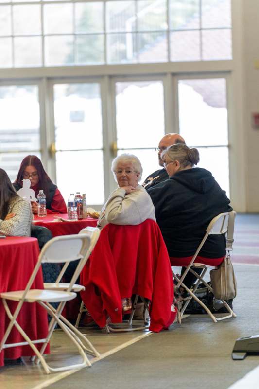 a group of people sitting at tables