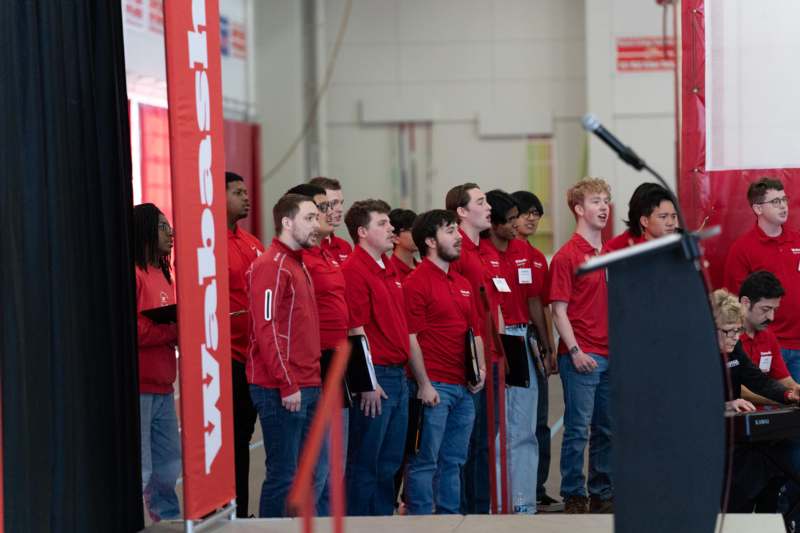 a group of people standing in a line