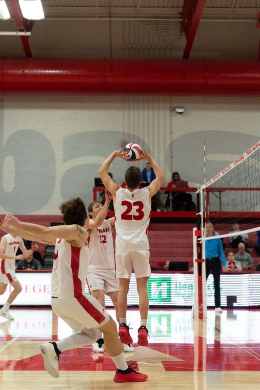 Volleyball vs Maranatha Baptist - a group of people playing volleyball