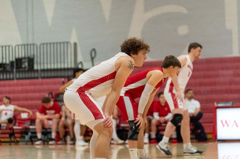 a group of men in uniform on a basketball court