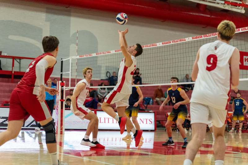 a group of men playing volleyball