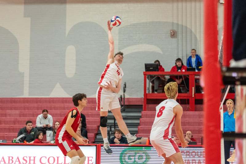 a group of men playing volleyball