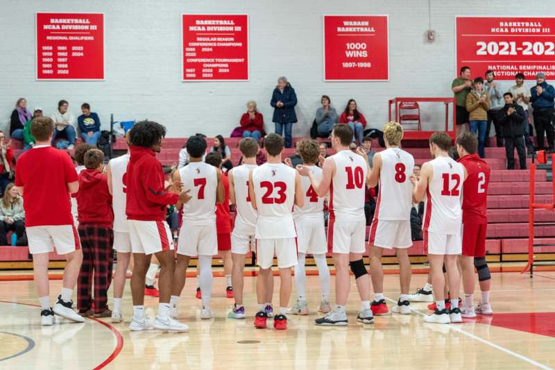 a group of people in a basketball court