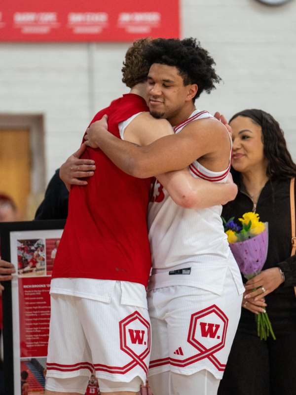 two basketball players hugging