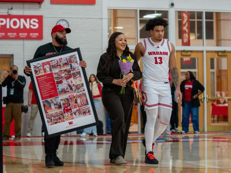 a group of people walking in a gym