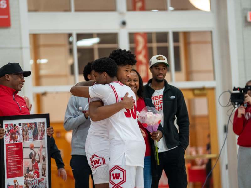 a group of people hugging each other