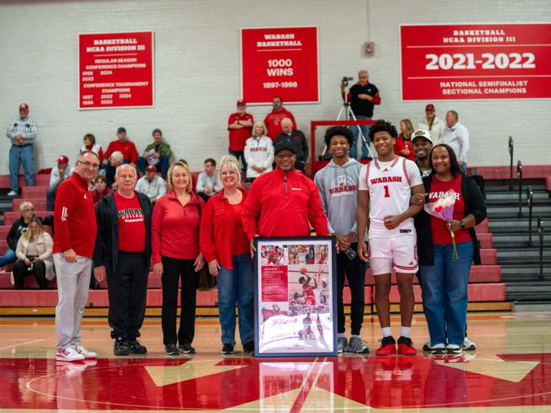 a group of people standing in a gym