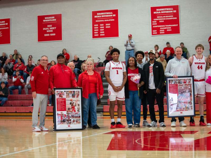 a group of people standing in a gym