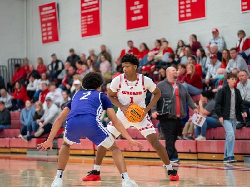 a group of people playing basketball