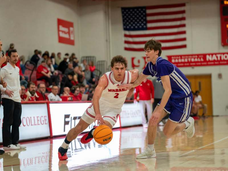 a basketball player chasing a basketball