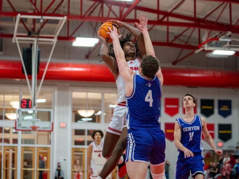 a group of men playing basketball