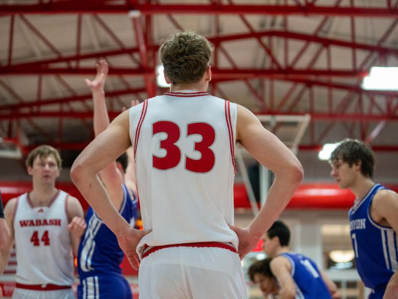 a group of men in a basketball court