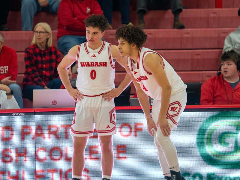 two basketball players standing on a court