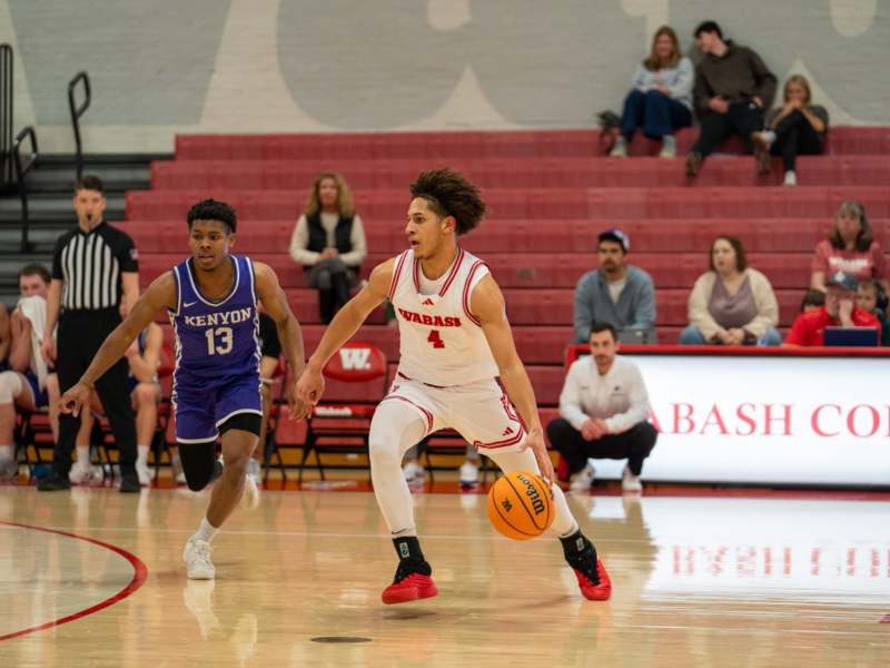 a basketball player dribbling a basketball