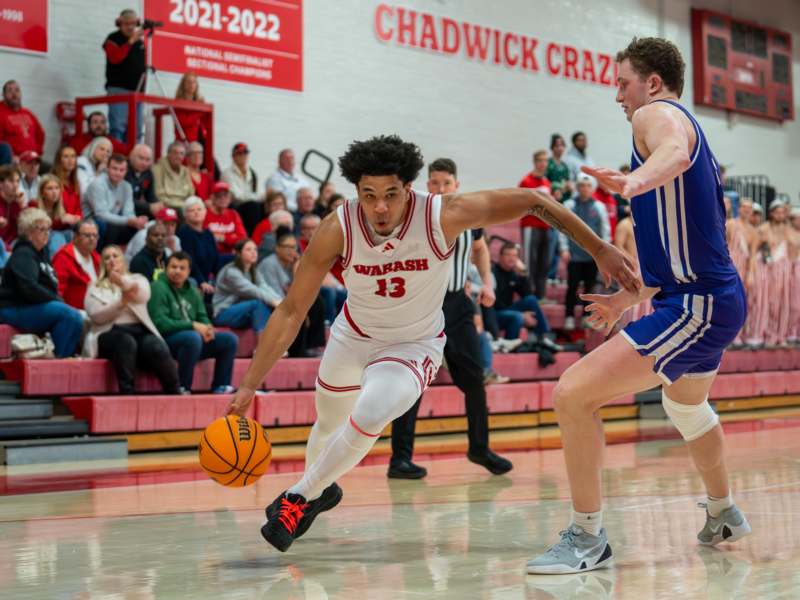 a basketball player dribbling a basketball