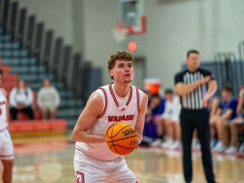 a man holding a basketball