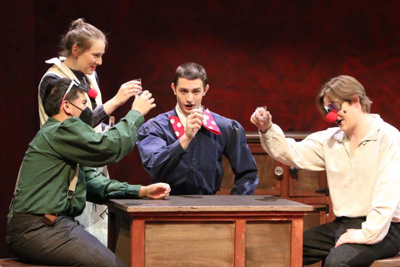 a group of people sitting at a table