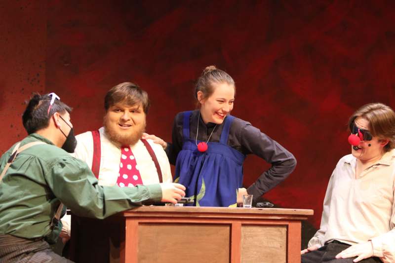 a group of people sitting at a podium