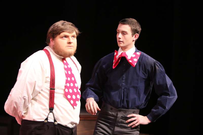 a man in a red tie and a man in a blue shirt