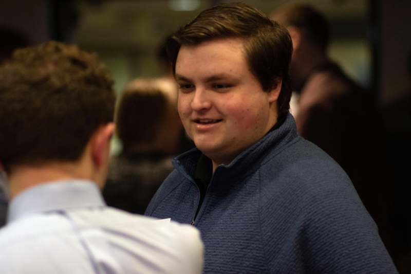 a man in a blue jacket