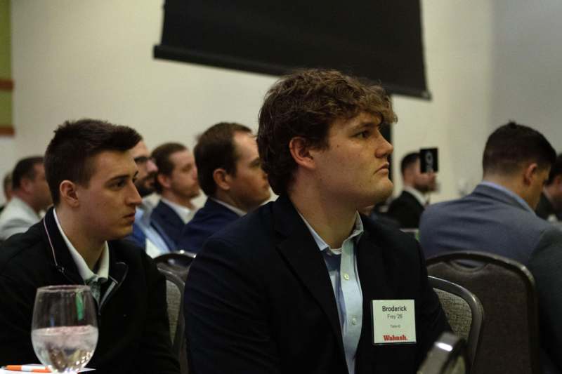 a group of people sitting in chairs