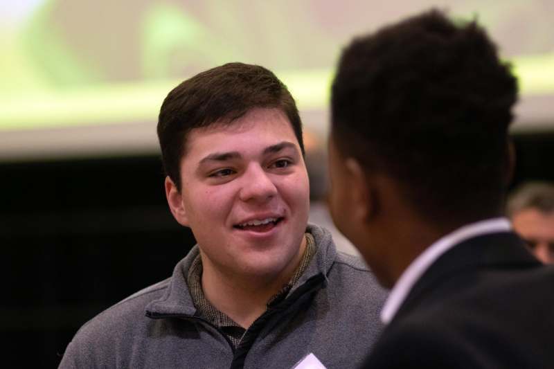 a man talking to another man