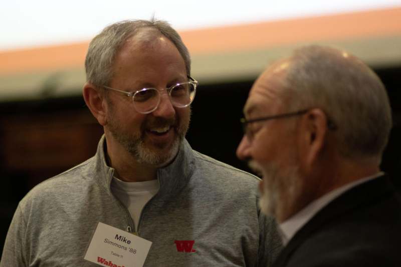 a man laughing with another man