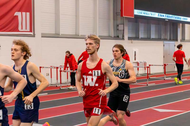 a group of people running on a track
