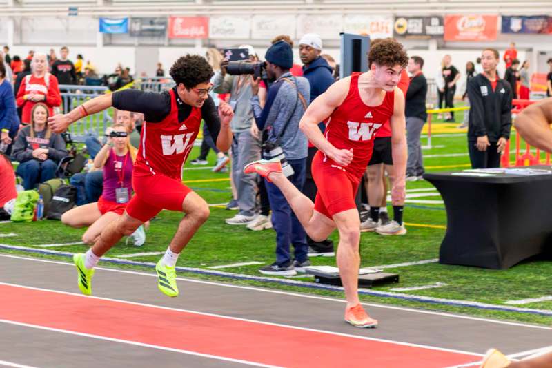two men running on a track