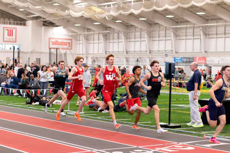 a group of people running on a track